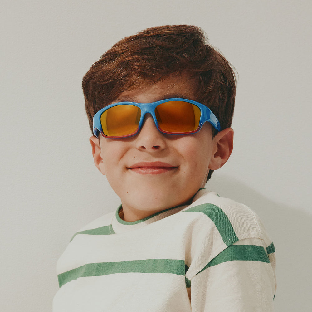 Cancer Council | Puppy Toddler Sunglasses | Metallic Blue/Red | Model