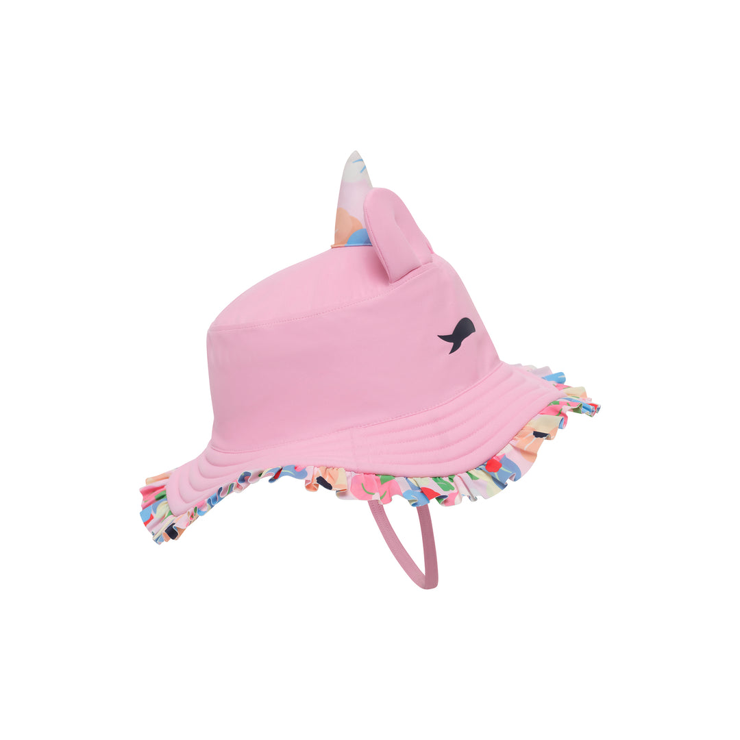 A pink children's sun hat with a unicorn horn, a small black unicorn face detail, and a colorful ruffled brim with a pink chin strap, shown on a plain white background.