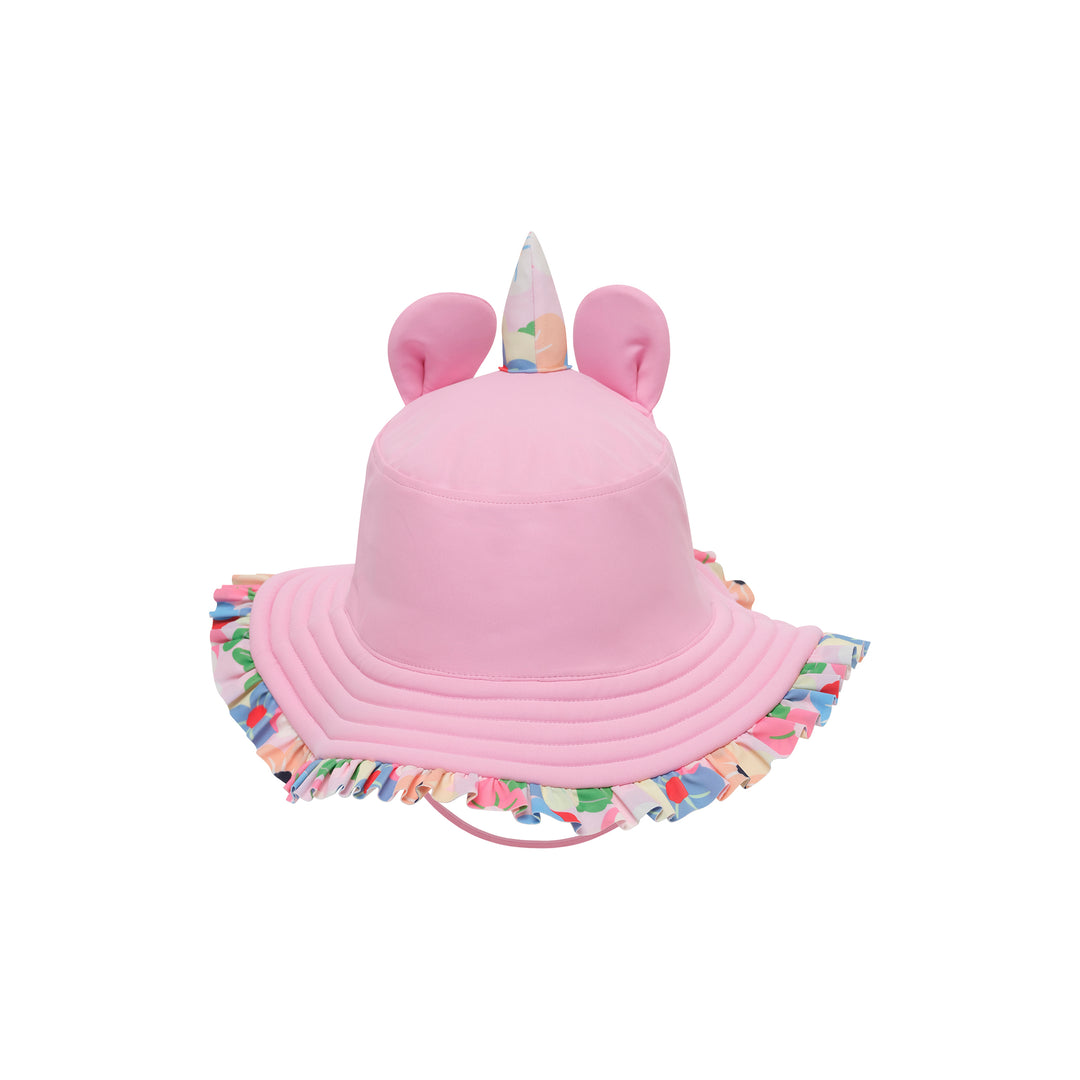 A pink children's sun hat with a ruffled brim, featuring a unicorn horn on top, two pink ears, and a multicolor patterned ruffle trim.
