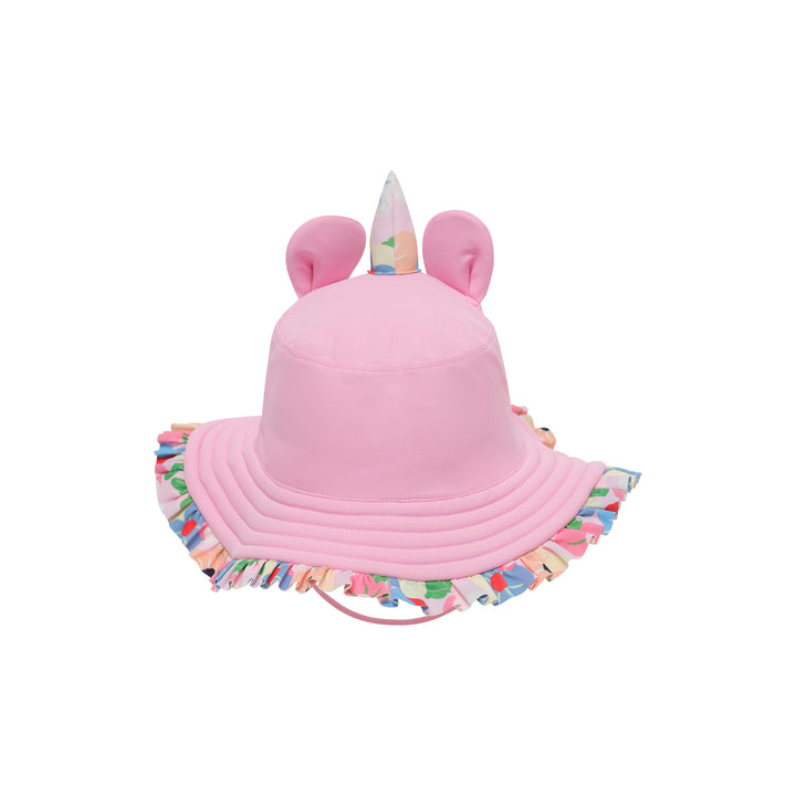 A pink children's sun hat with a ruffled brim, featuring a unicorn horn on top, two pink ears, and a multicolor patterned ruffle trim.