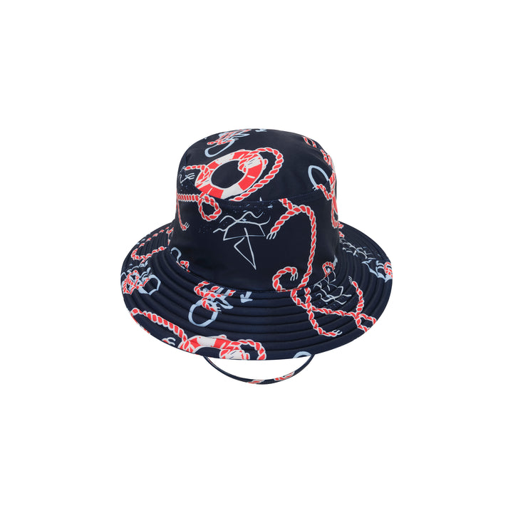 A navy blue bucket hat with a nautical print featuring red and white ropes, life preservers, anchors, and white starry details, shown against a plain white background.