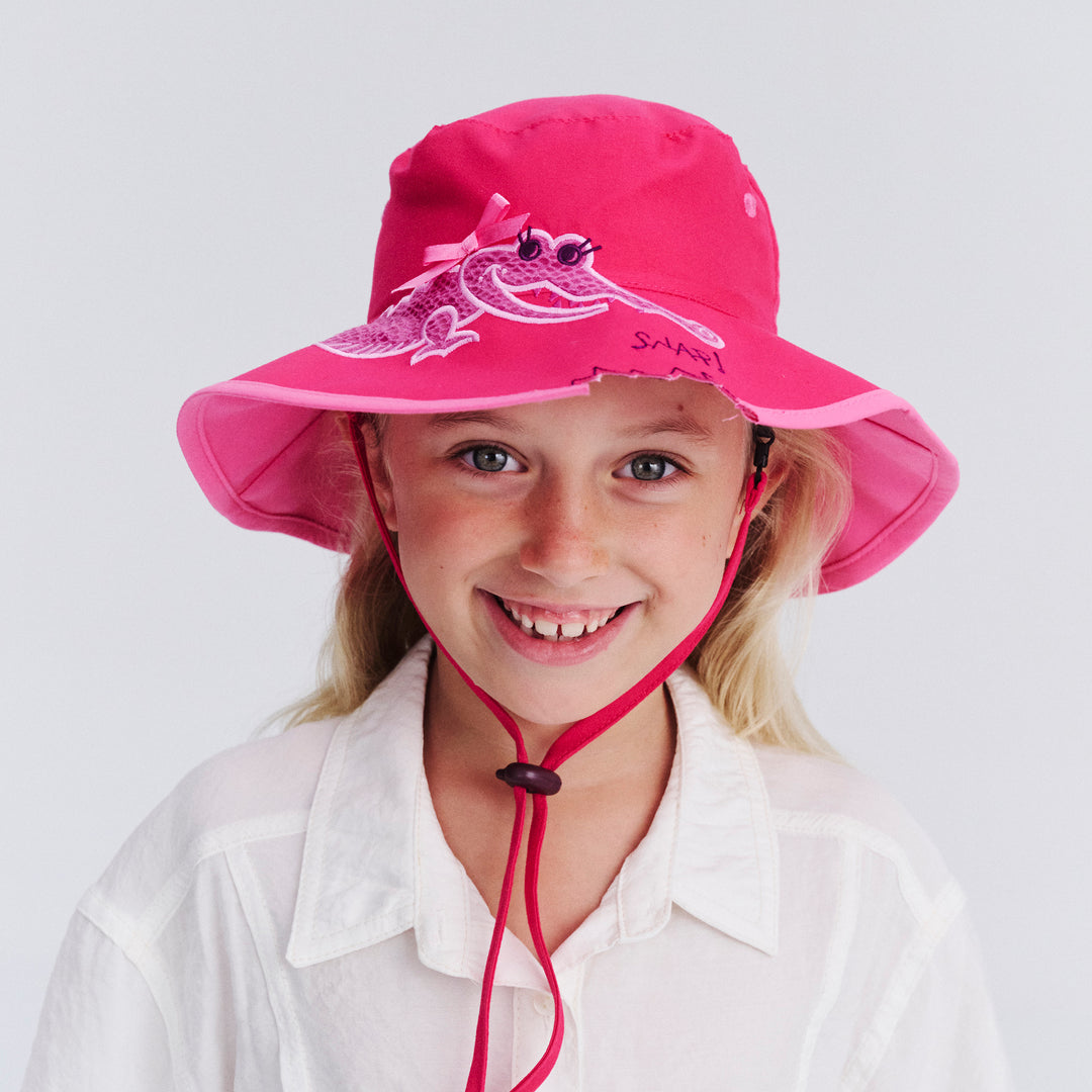 Child model wearing Awesome wide brim hat in Pink Croc, front‑facing view