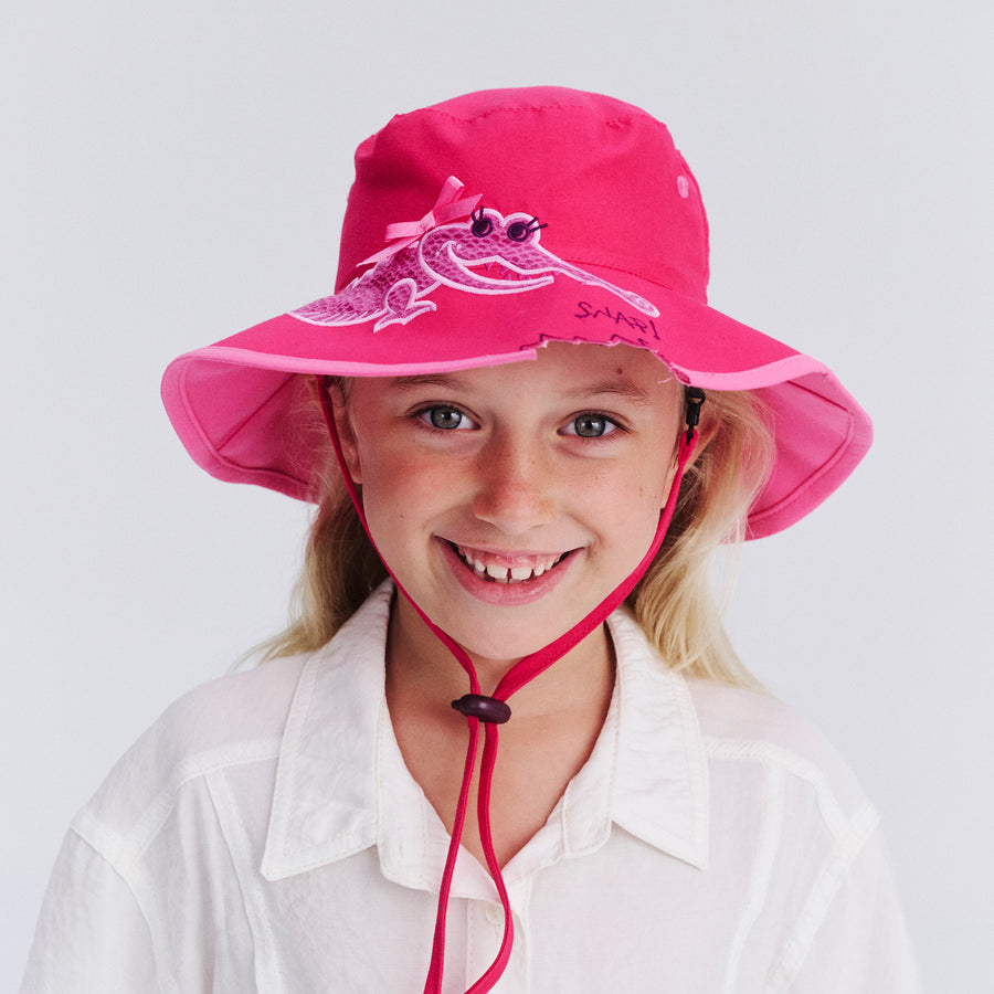 Child model wearing Awesome wide brim hat in Pink Croc, front‑facing view