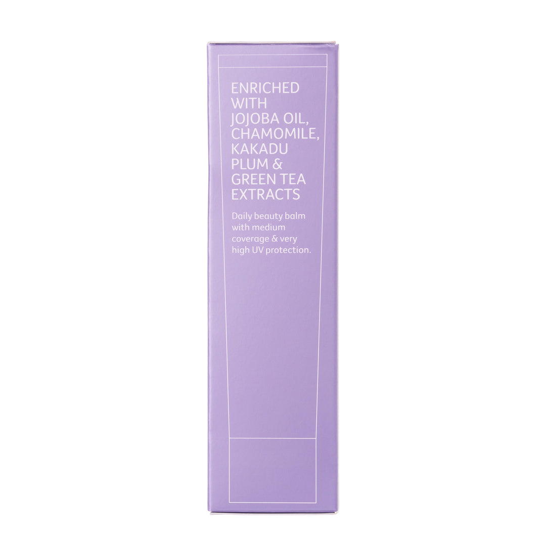 Purple sunscreen box from side, highlighting ingredients Jojoba oil, chamomile, kakadu plum and green tea