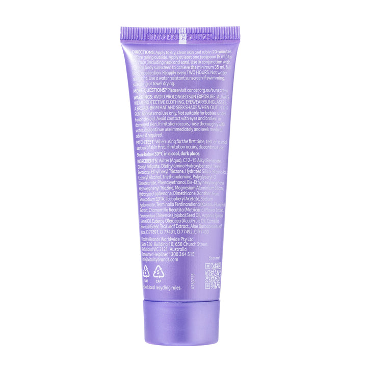 A lavender purple squeeze tube of hair product shown from the back, featuring dense white text instructions and a matching purple cap, isolated on a white background.