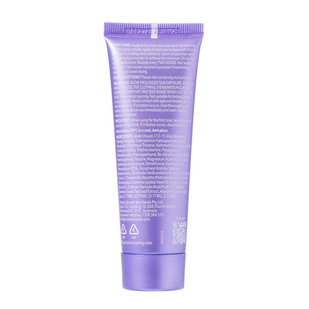 A purple squeeze tube of sunscreen shown from the back, featuring white text detailing functions, instructions, warnings, and ingredients, set against a plain white background.