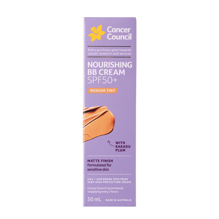 A 50 mL box of Cancer Council Nourishing BB Cream SPF50+ with a medium tint, featuring a lavender purple background, yellow logo, and an illustration of a tan cream smear.