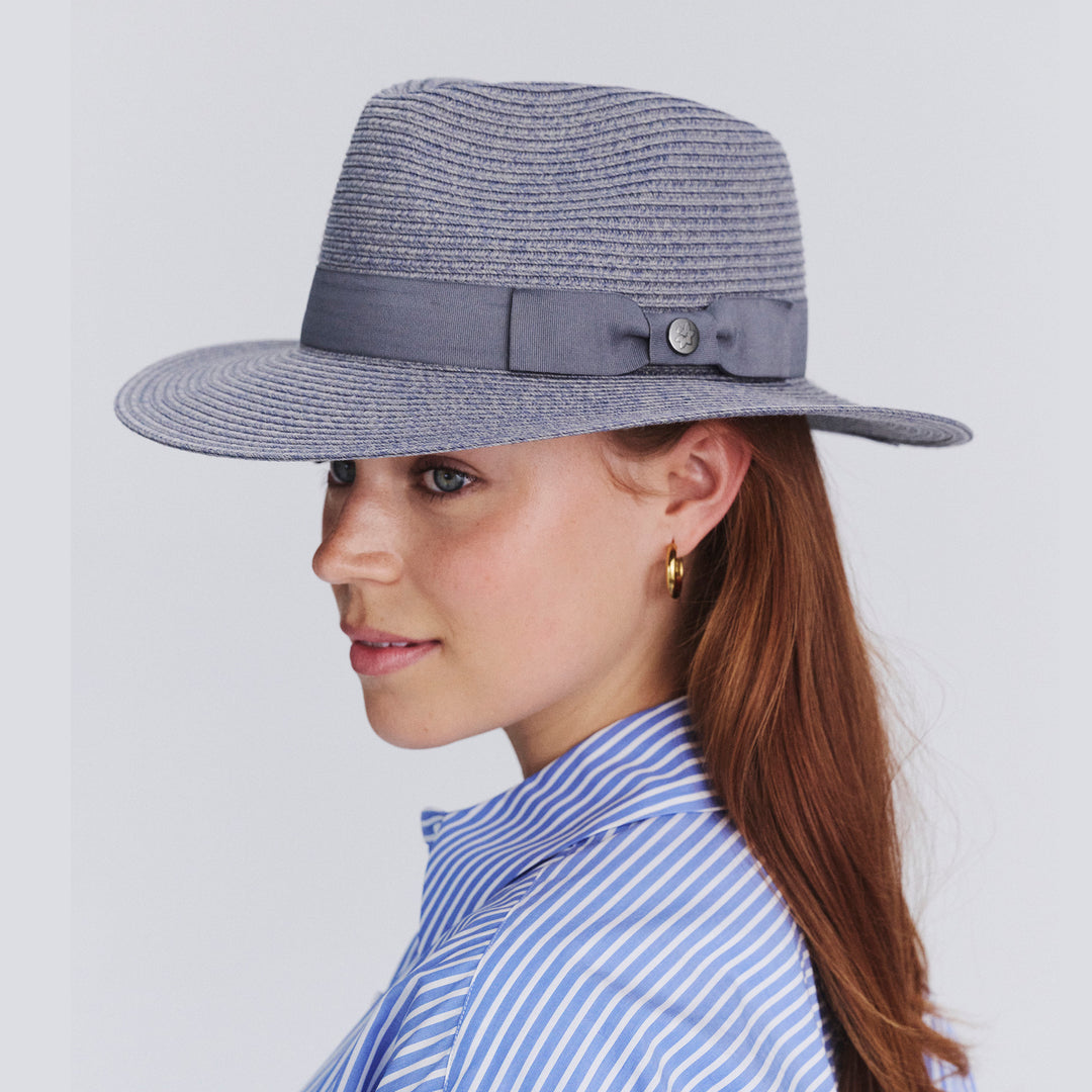 Female model wearing Sherry Fedora Hat in Mixed Blue colour, side profile showing brim coverage