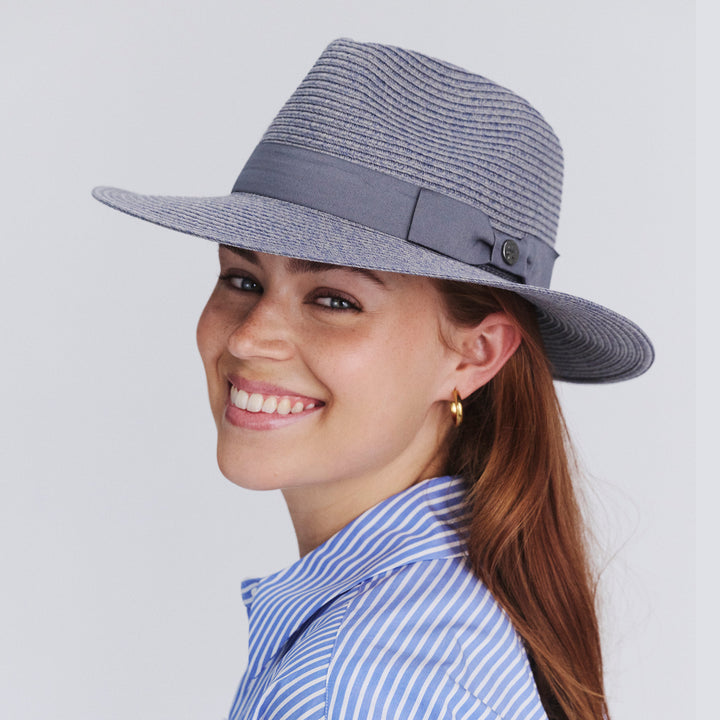 Female model wearing Sherry Fedora Hat in Mixed Blue colour, three-quarter angle highlighting shape and silhouette