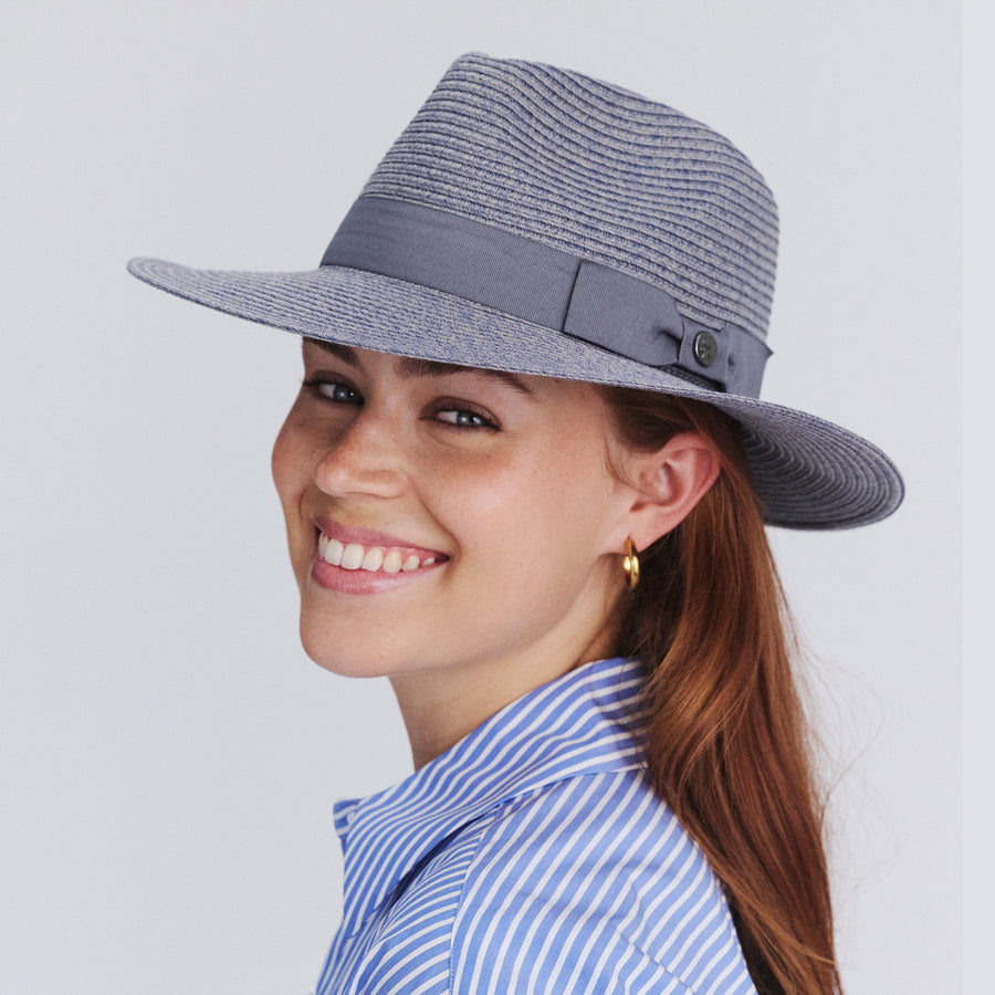 Female model wearing Sherry Fedora Hat in Mixed Blue colour, three-quarter angle highlighting shape and silhouette