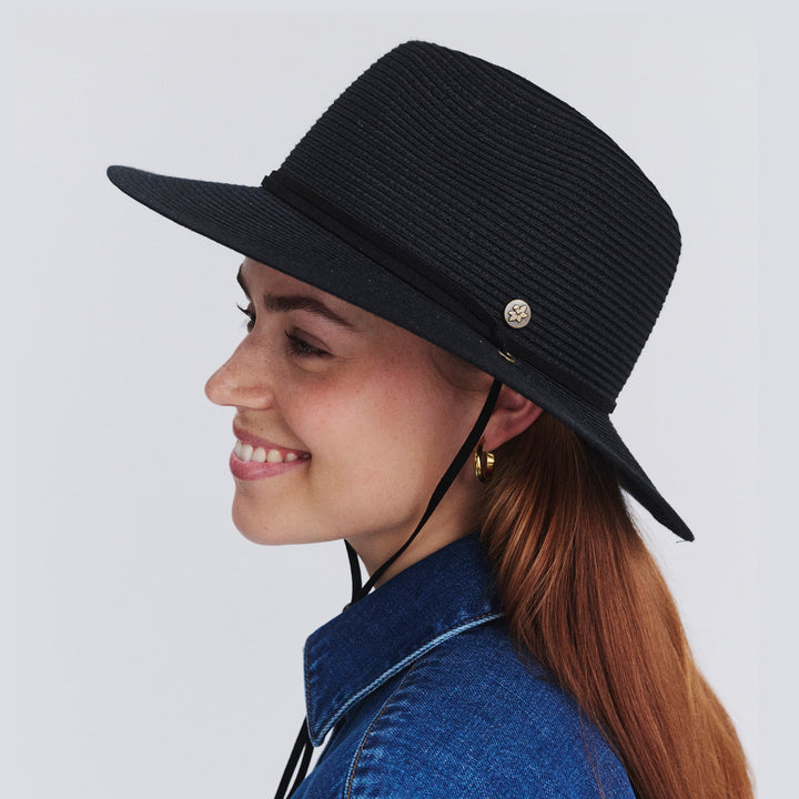 Female model wearing Jody Fedora Hat in Black colour, side profile showing brim coverage
