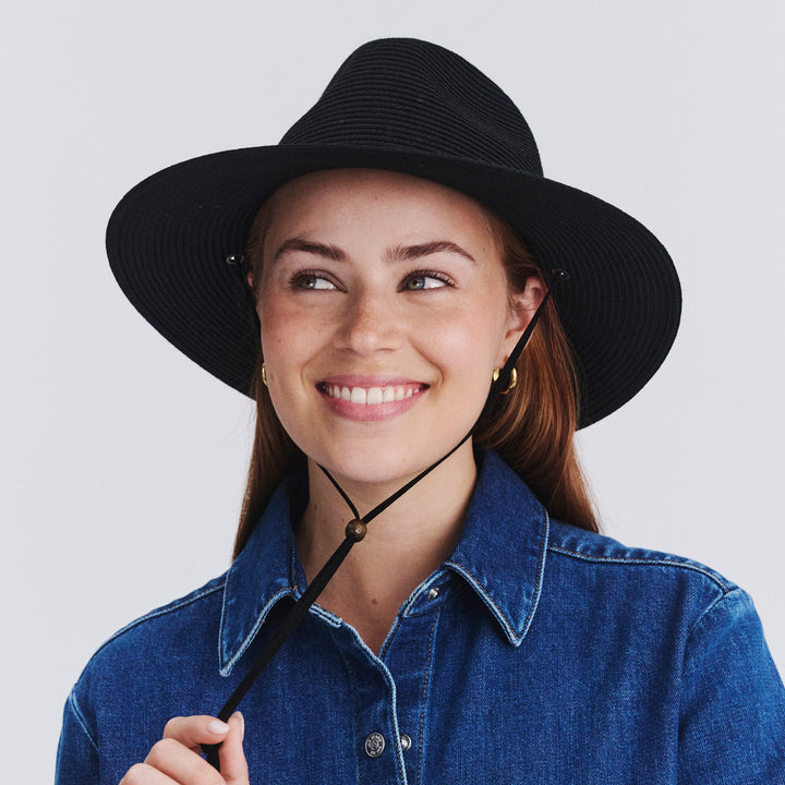 Female model wearing Jody Fedora Hat in Black colour, front view showcasing fit and wide brim