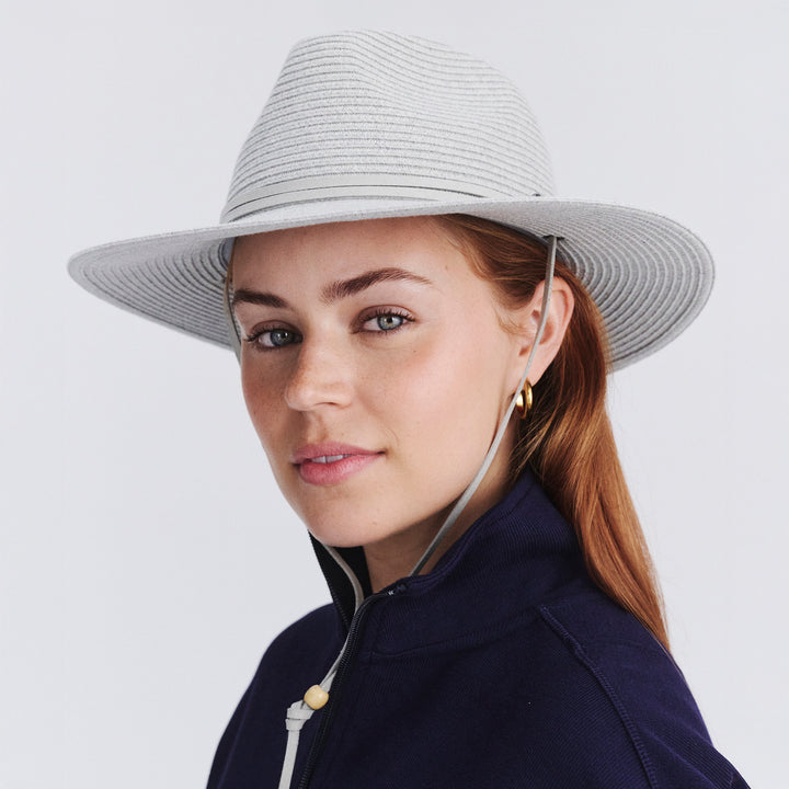 Female model wearing Jody Fedora Hat in Light Grey colour, quarter angle highlighting shape and silhouette