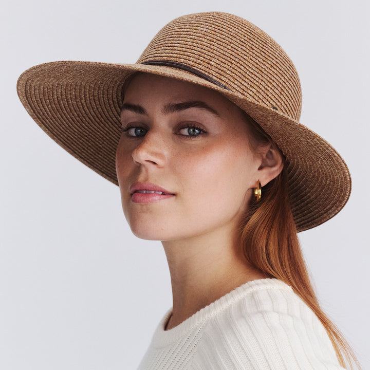 Female model wearing Maribel Cloche Hat in Cinnamon colour, three-quarter angle highlighting shape and silhouette