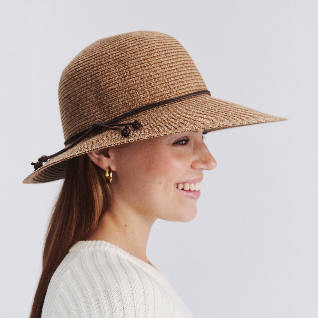 Female model wearing Maribel Cloche Hat in Cinnamon colour, side profile showing brim coverage
