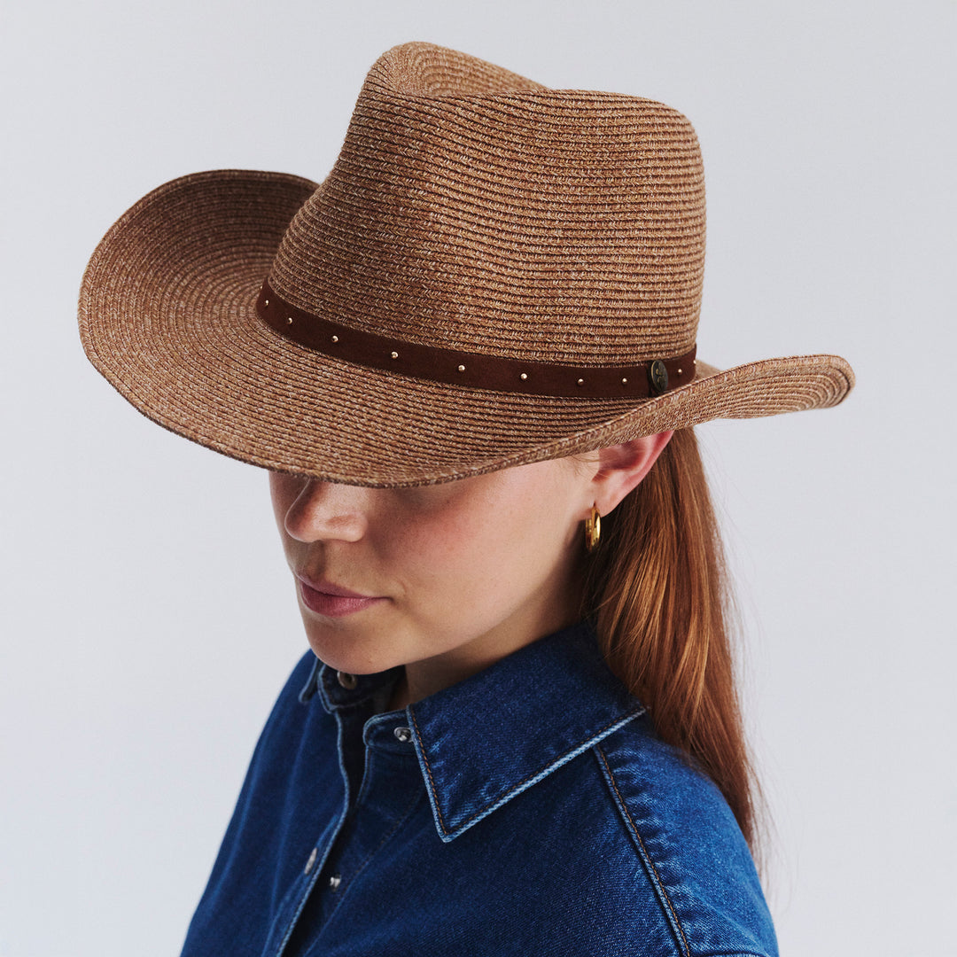 Female model wearing Jace Cowboy Hat in Cinnamon colour, angled down view showing crown shape