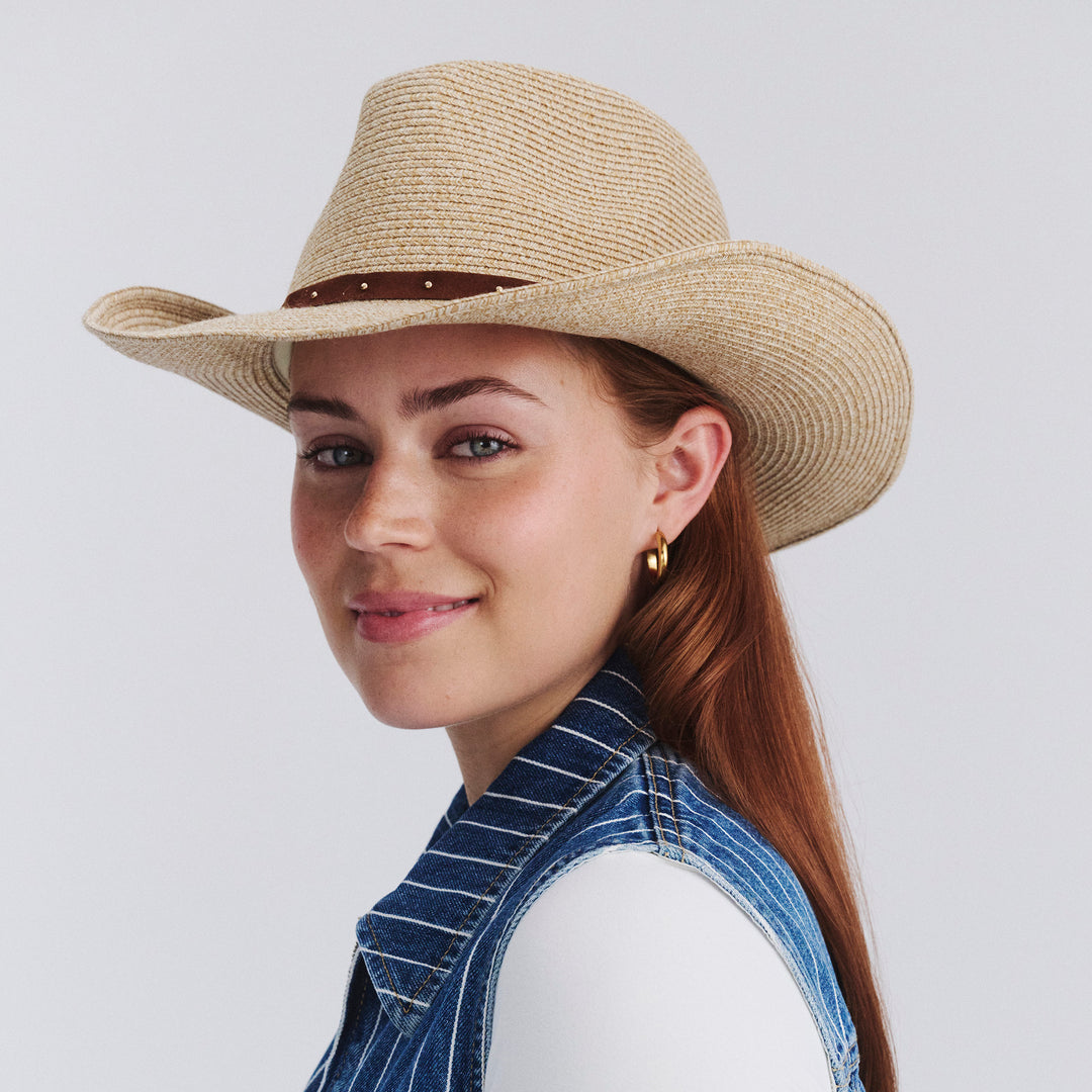 Female model wearing Jace Cowboy Hat in Natural colour, three-quarter angle highlighting shape and silhouette