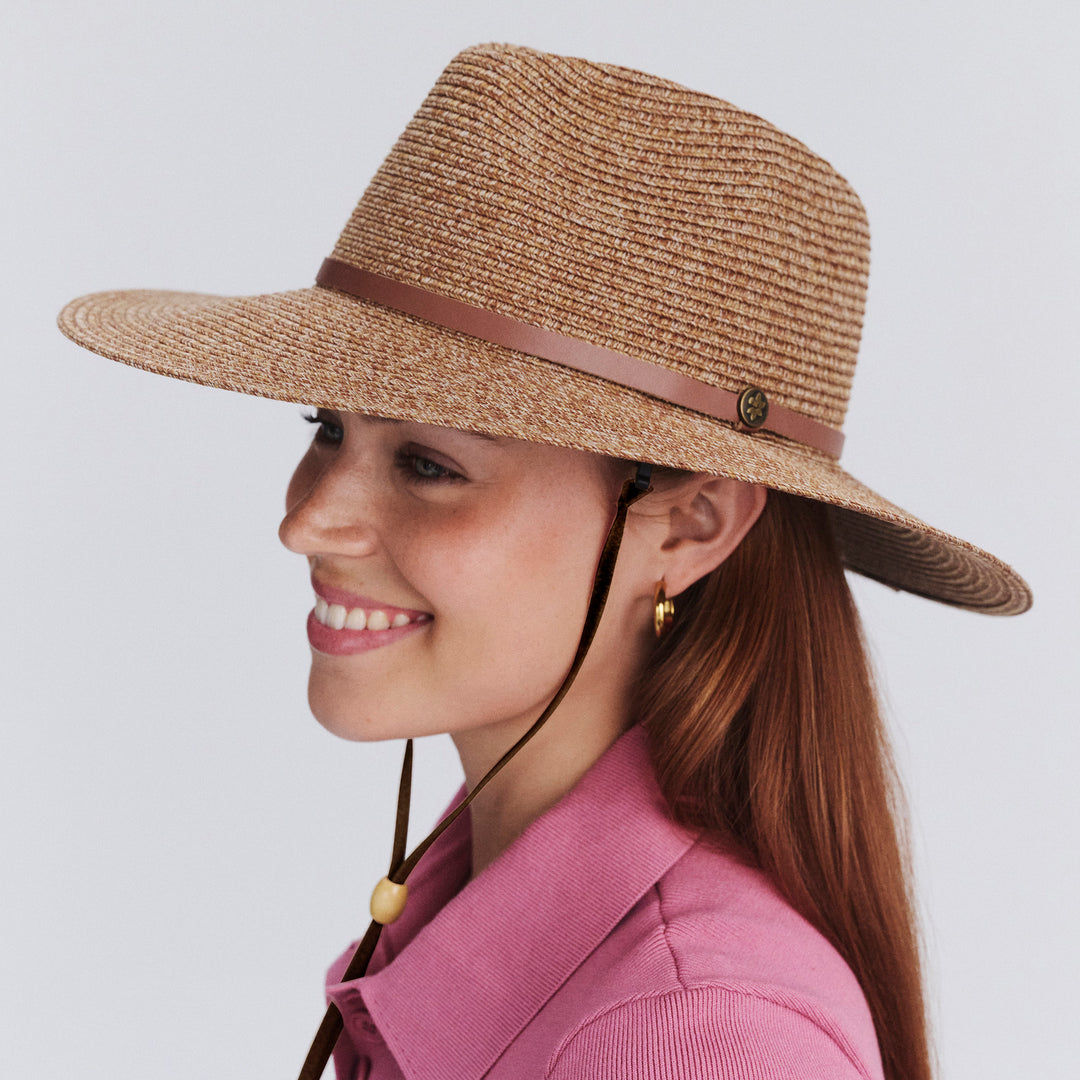 Female model wearing Mitzi Wide Brim Fedora Hat in Cinnamon colour, side profile showing brim coverage