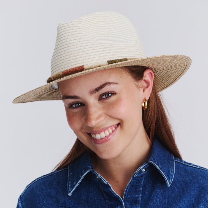 Female model wearing Sasha Fedora Hat in Ivory/Natural colour, three-quarter angle highlighting shape and silhouette