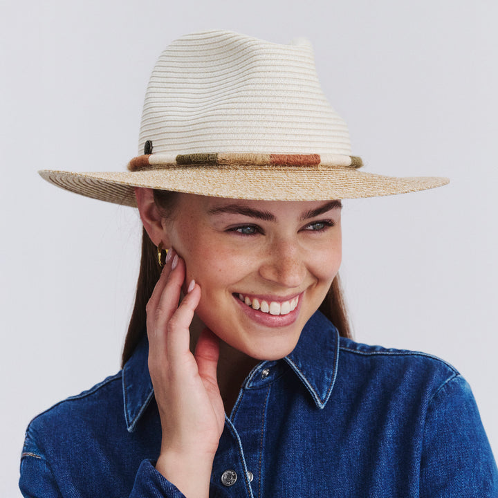 Female model wearing Sasha Fedora Hat in Ivory/Natural colour, front view showcasing trim detailing
