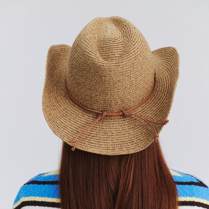 Female model wearing Kasey Cowboy Hat in Camel colour, back view showing brim shape