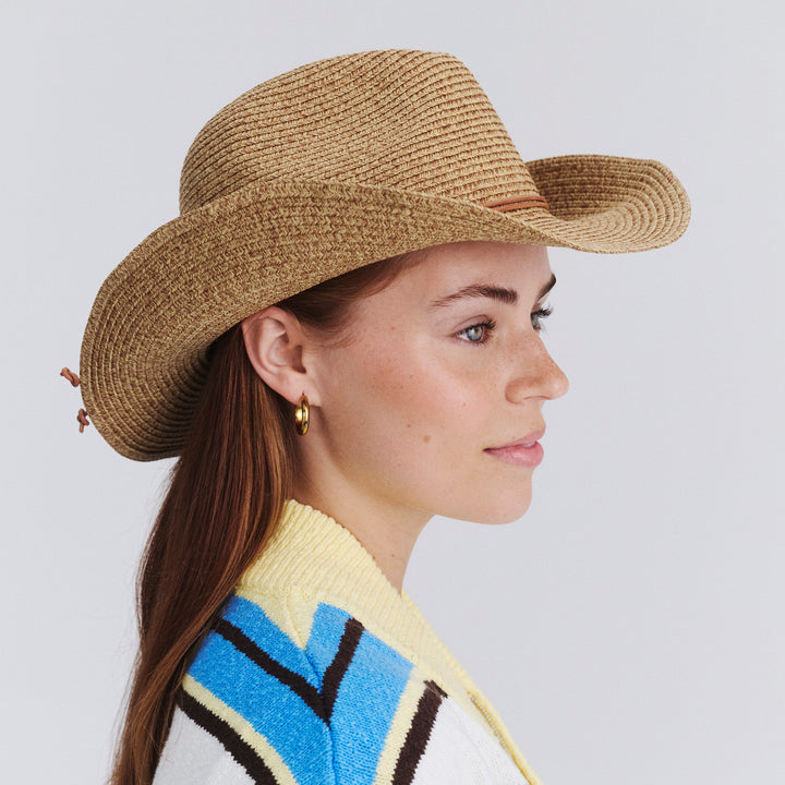 Female model wearing Kasey Cowboy Hat in Camel colour, side profile showing brim design