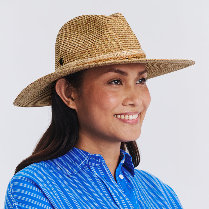 Female model wearing Roxy Wide Brim Fedora Hat in Camel colour, three-quarter angle highlighting shape and silhouette