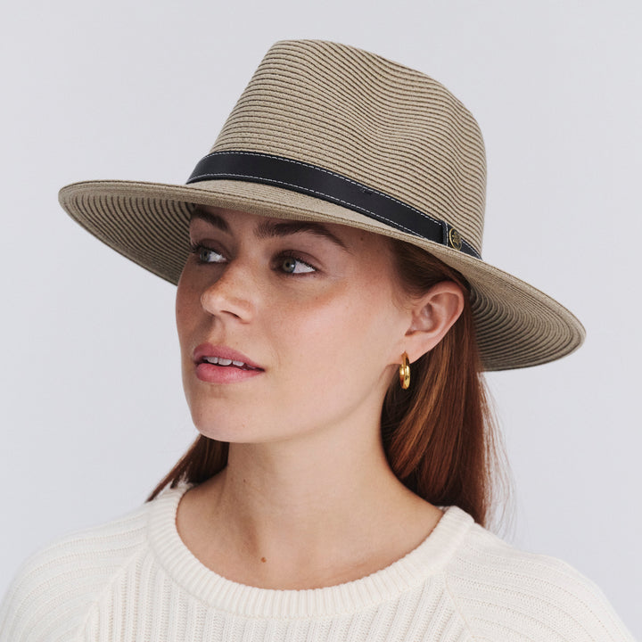 Female model wearing Morgan Fedora Hat in light khaki colour, front view styled with white top
