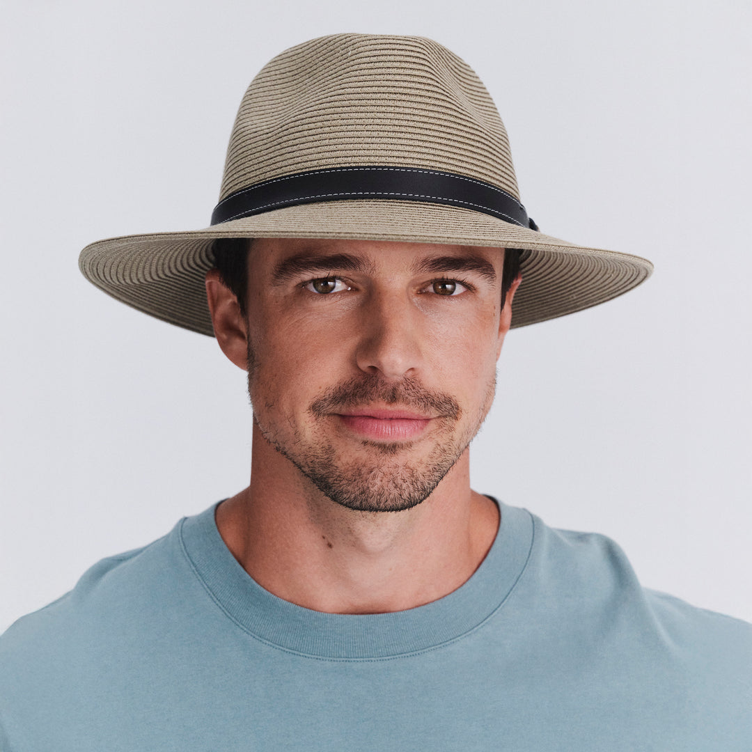 Male model wearing Morgan Fedora Hat in light khaki colour with black band
