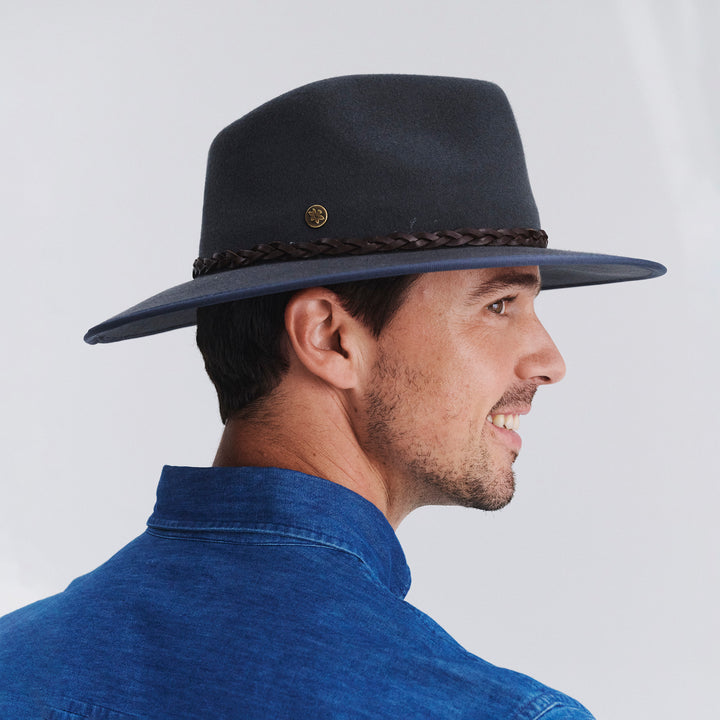 Male model wearing Bartle Fedora Hat in grey colour, side profile showing brim width and silhouette