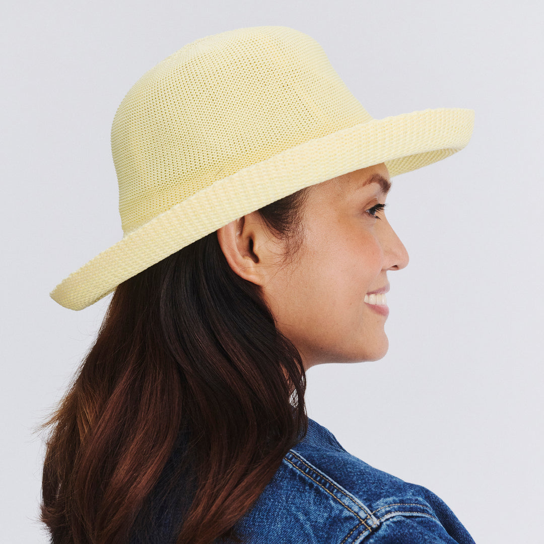 Female model wearing Classic Breton Hat in Lemon colour, side profile showing brim coverage