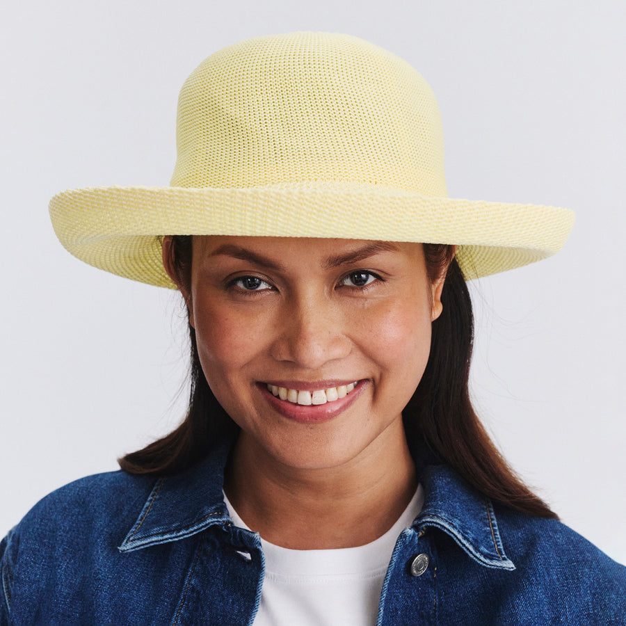 Female model wearing Classic Breton Hat in Lemon colour, front view showcasing fit and wide brim