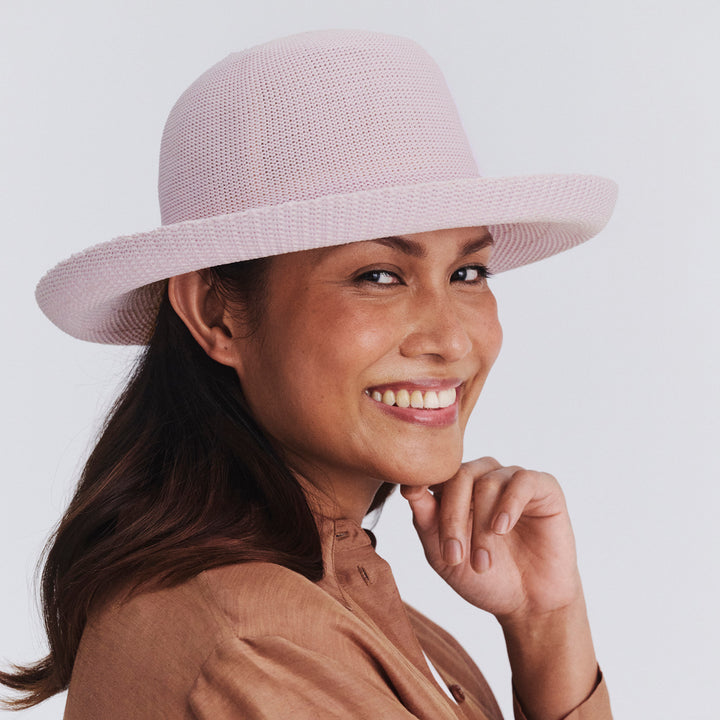 Female model wearing Classic Breton Hat in Lilac colour, three-quarter angle highlighting shape and silhouette