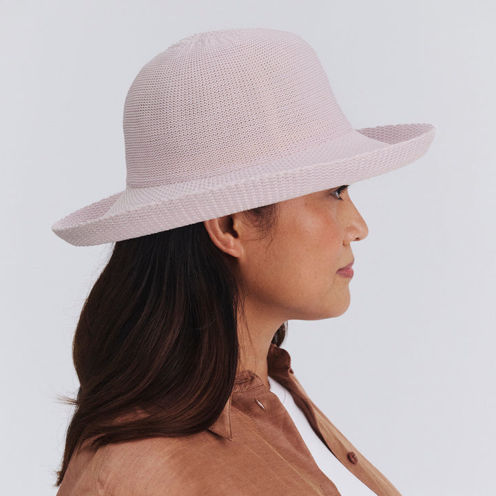 Female model wearing Classic Breton Hat in Lilac colour, side profile showing brim coverage

