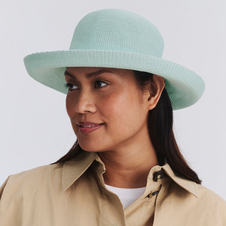 Female model wearing Classic Breton Hat in mint blue colour, three-quarter angle highlighting shape and silhouette