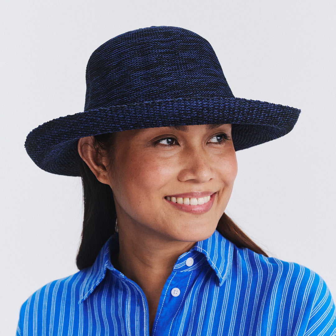 Female model wearing Classic Breton hat in Mixed Navy, front‑facing view
