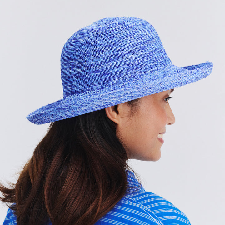 Side profile of female model wearing Classic Breton hat in Mixed Ocean
