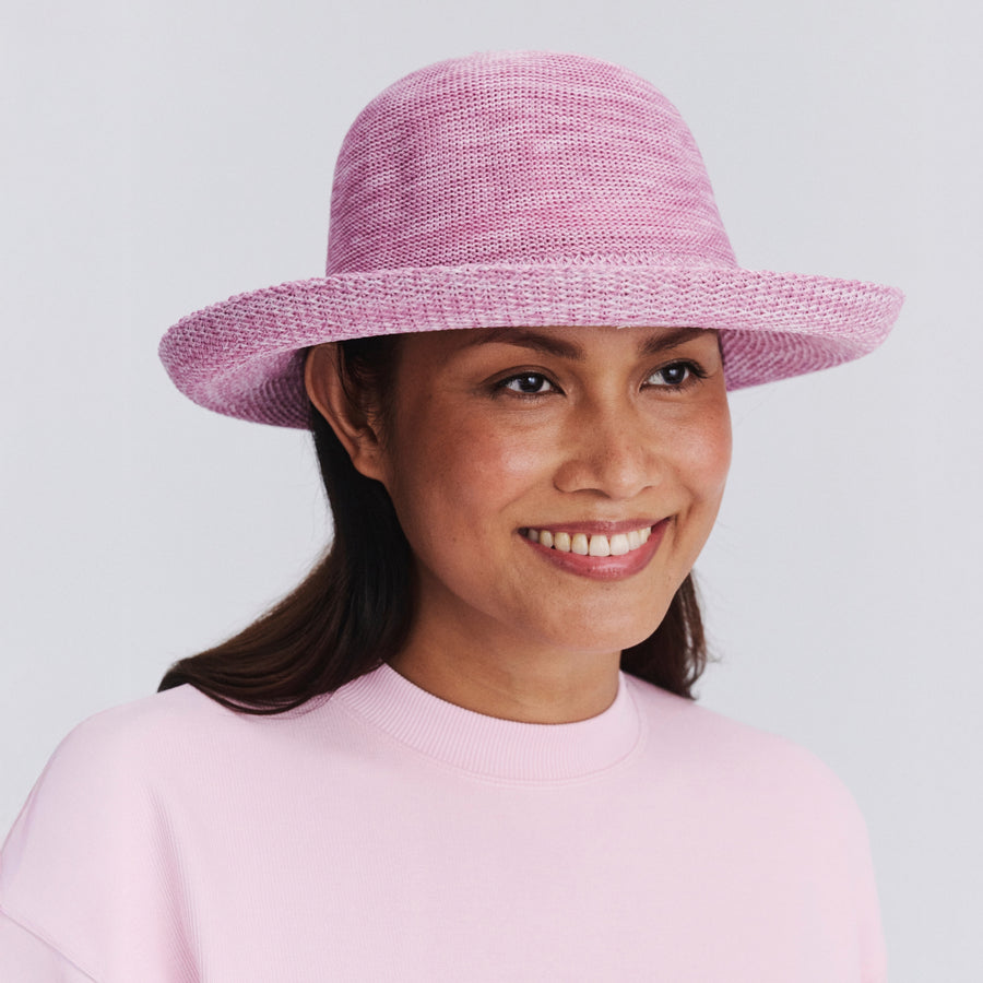 Female model wearing Classic Breton hat in Old Rose Pink, front‑facing view