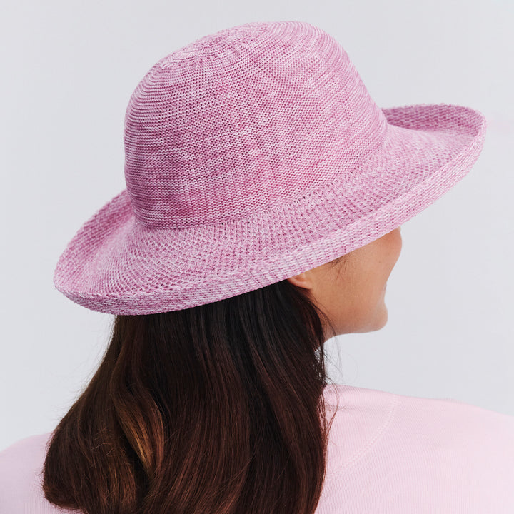 Back view of female model wearing Classic Breton hat in Old Rose Pink showing brim shape and rear detailing