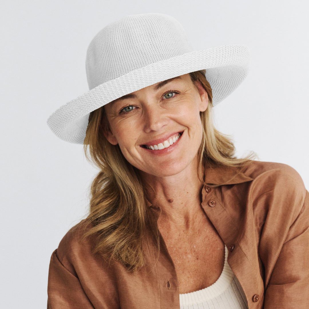 Female model wearing Classic Breton Hat in white colour, front view showcasing fit and sun-protective wide brim