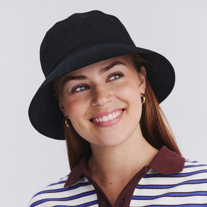 Female model wearing Tamzin bucket hat in Black, front‑facing view