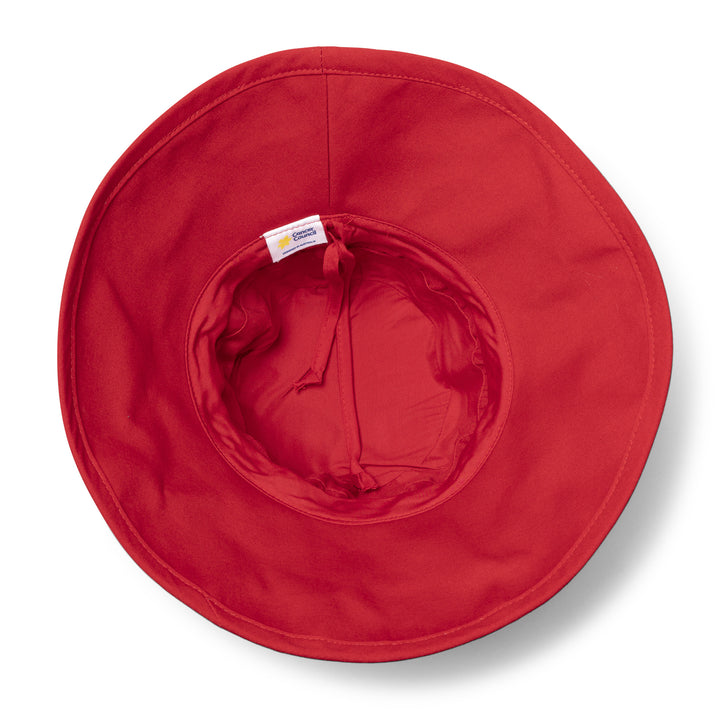 Essential Traveller Hat in poppy red colour, underside of brim showing interior finish and size adjuster