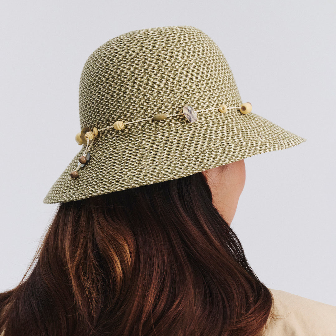 Side profile of female model wearing Bohemian bucket hat in Pistachio