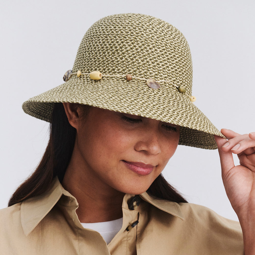 Female model wearing Bohemian bucket hat in Pistachio, front‑facing view with brim tipped