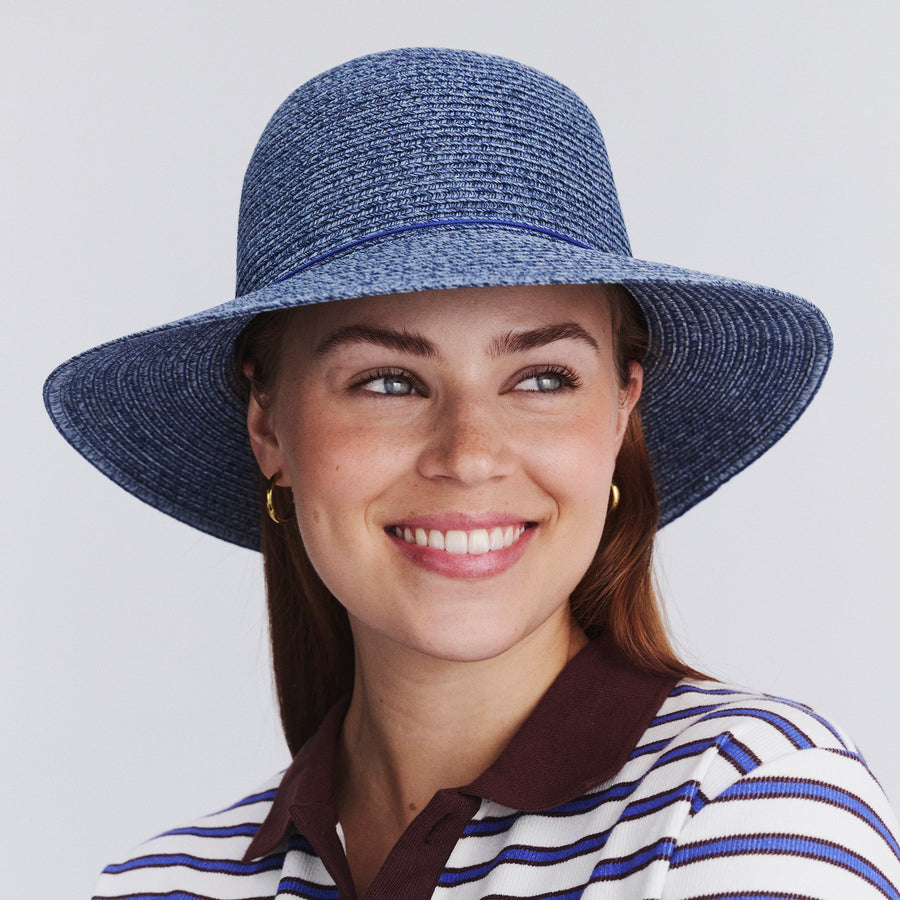 Female model wearing Lacey bucket hat in Denim, front‑facing view