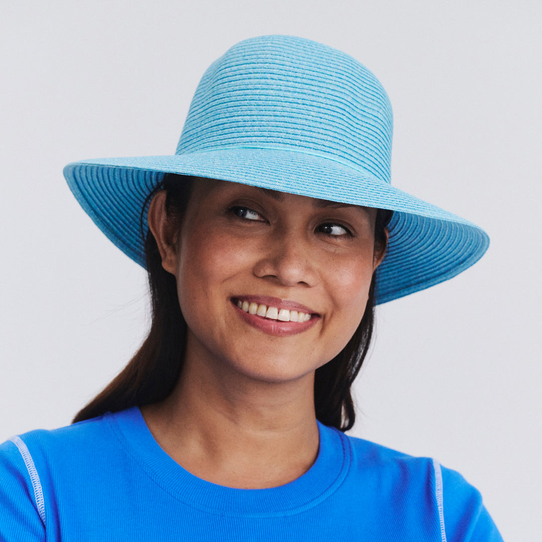 Female model wearing Lacey bucket hat in Mixed Blue, front‑facing view