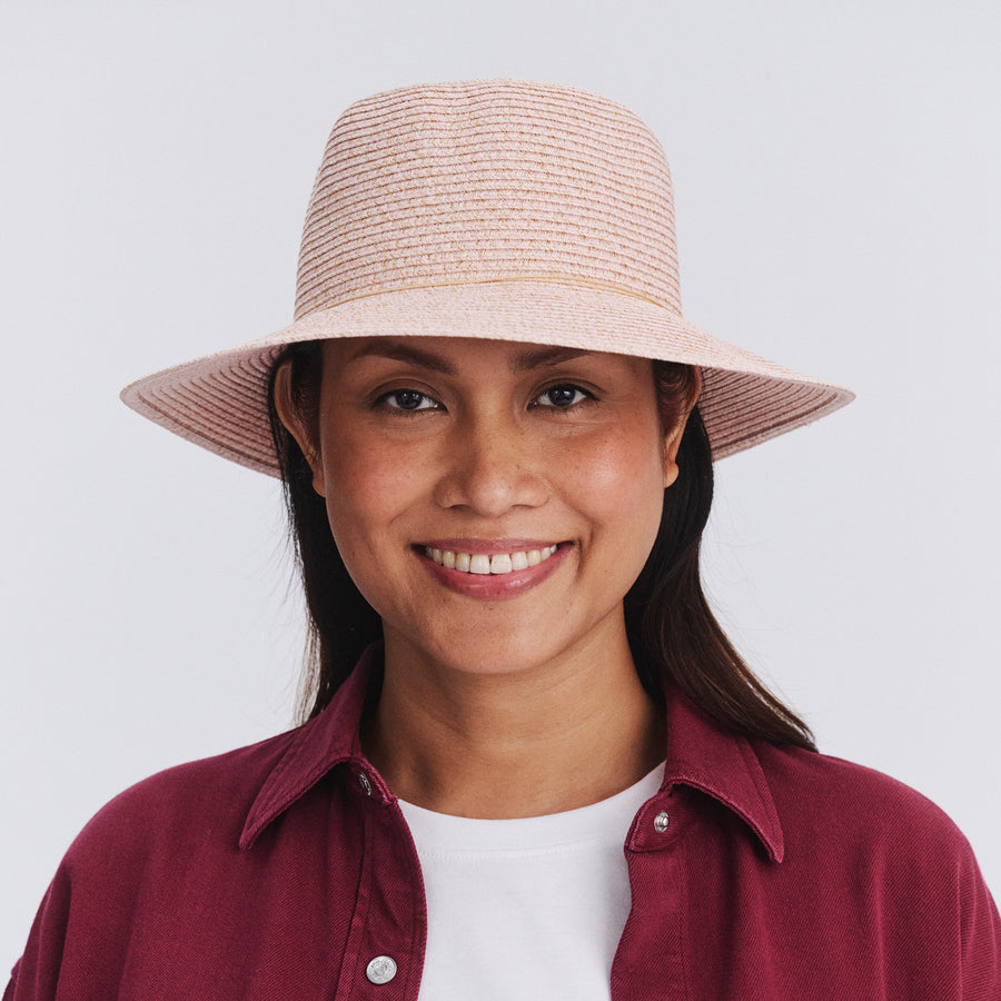 Female model wearing Lacey bucket hat in Soft Pink, front‑facing view