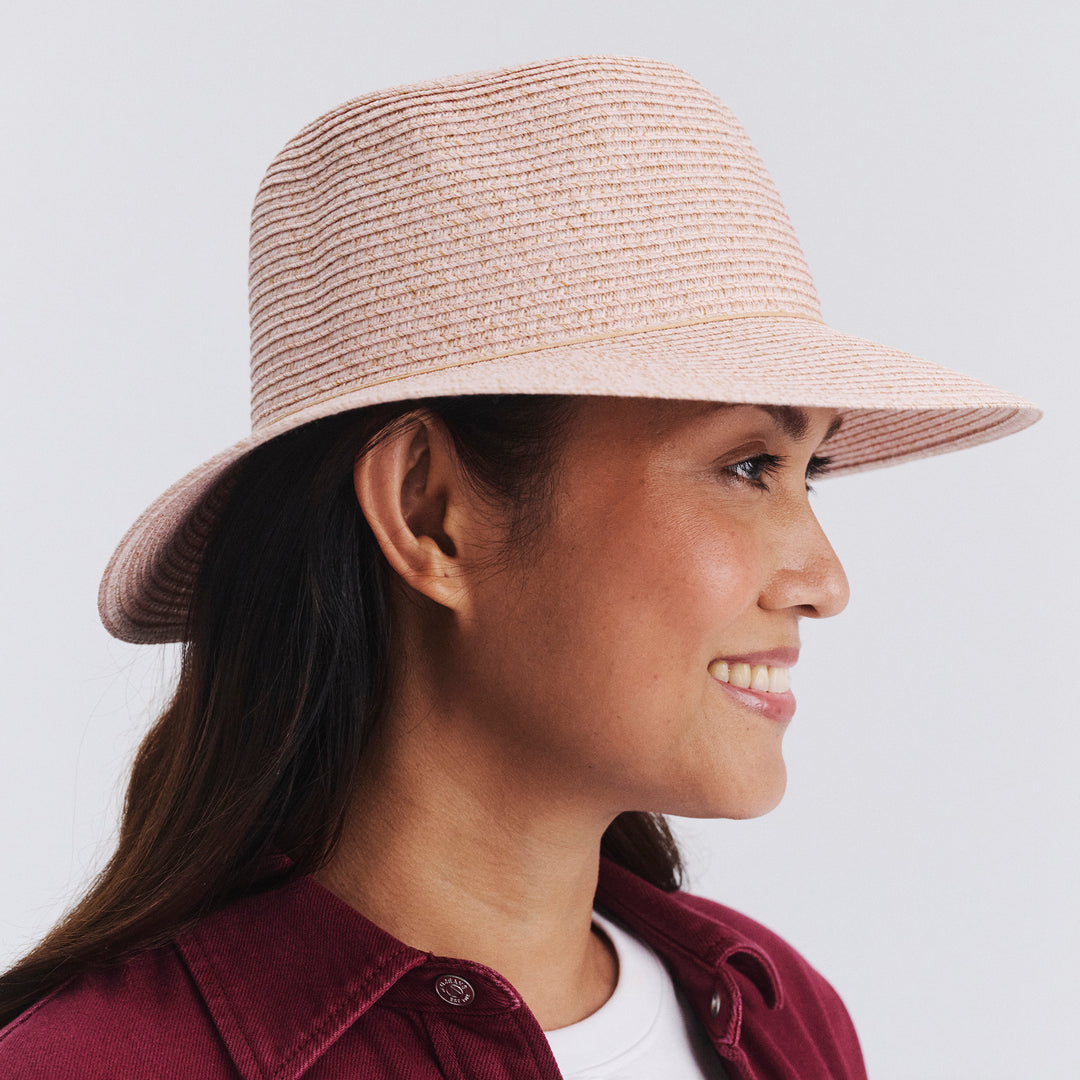 Side profile of female model wearing Lacey bucket hat in Soft Pink