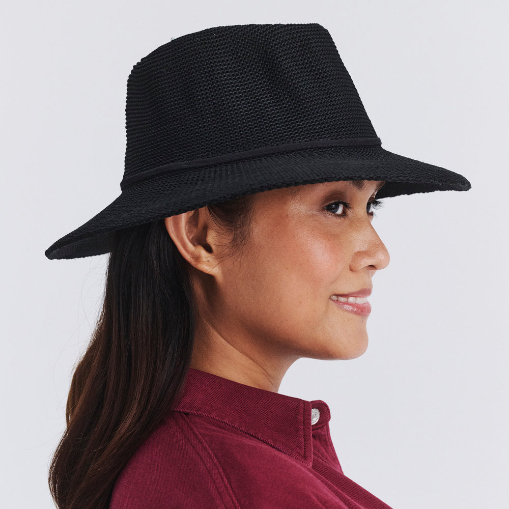 Side profile of female model wearing Jacqui mannish hat in Black