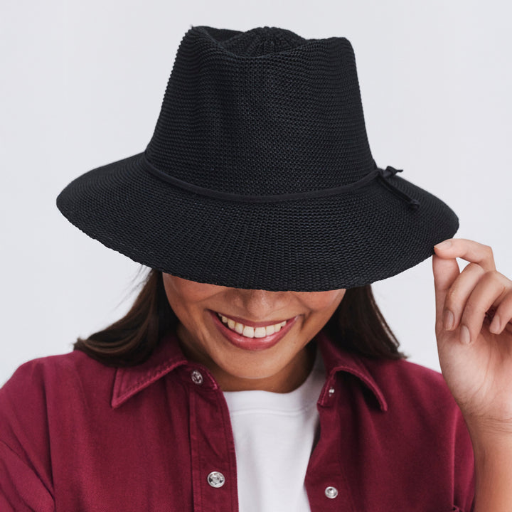 Female model wearing Jacqui mannish hat in Black, front‑facing view with brim down